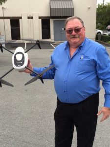 Glenn Smith, Vice President, CRU Adjusters, holds a Kespry Drone. (PRNewsfoto/Kespry)