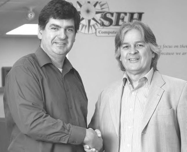 Allan Griwatz (left) with SEH Computer Systems Inc. President Kevin Remington. (Bill Gladding / Tavistock Gazette) Allan Griwatz (left) with SEH Computer Systems Inc. President Kevin Remington. (Bill Gladding / Tavistock Gazette)