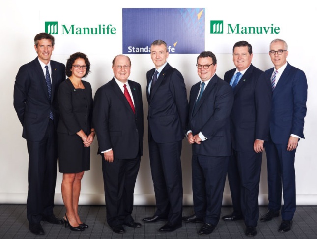 Senior executives from Manulife and Standard Life gather in Montreal for the announcement of Manulife's acquisition of the Canadian operations of Standard Life plc.
